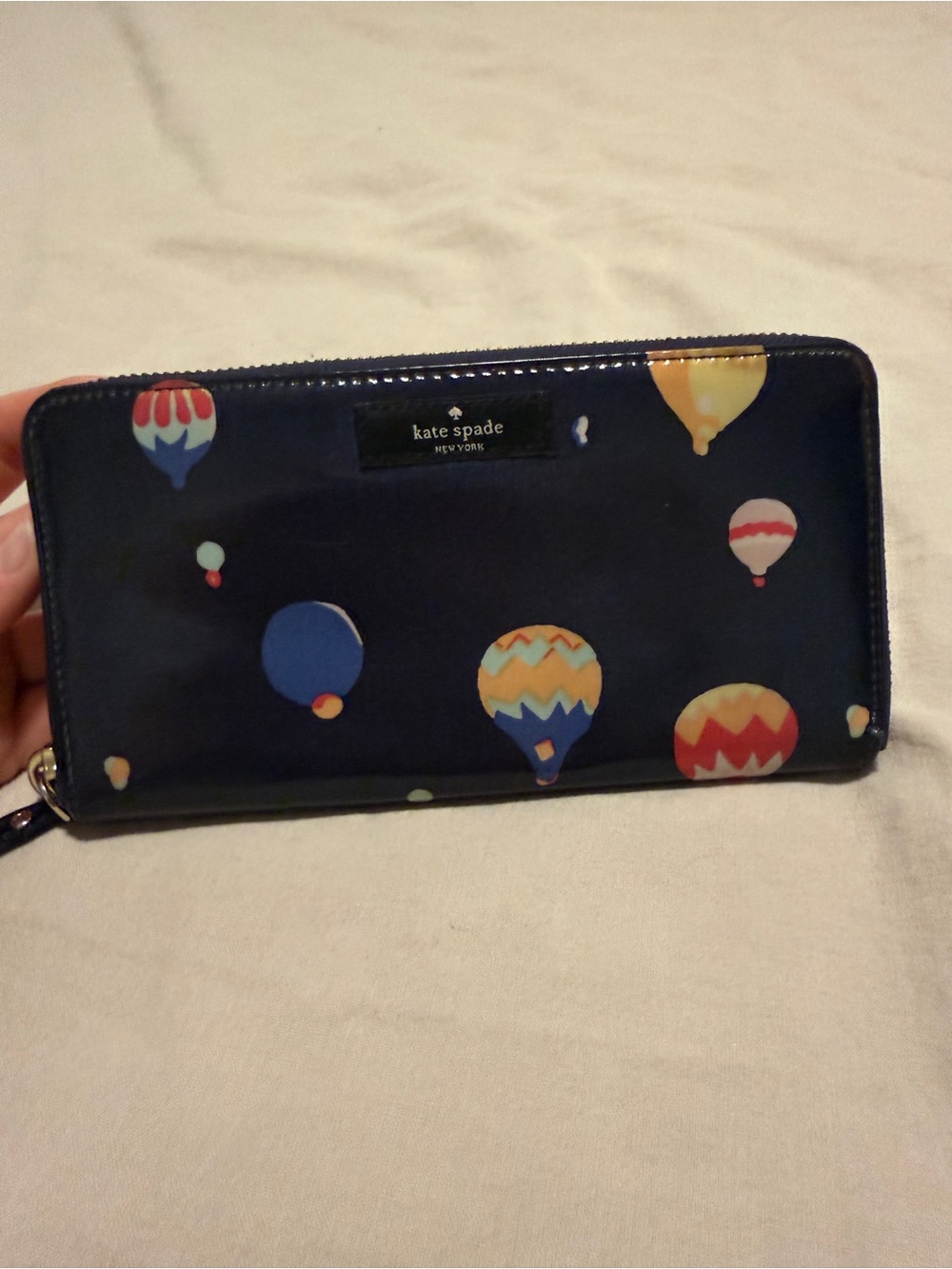 kate spade navy patent zip-around wallet with colorful hot air balloons